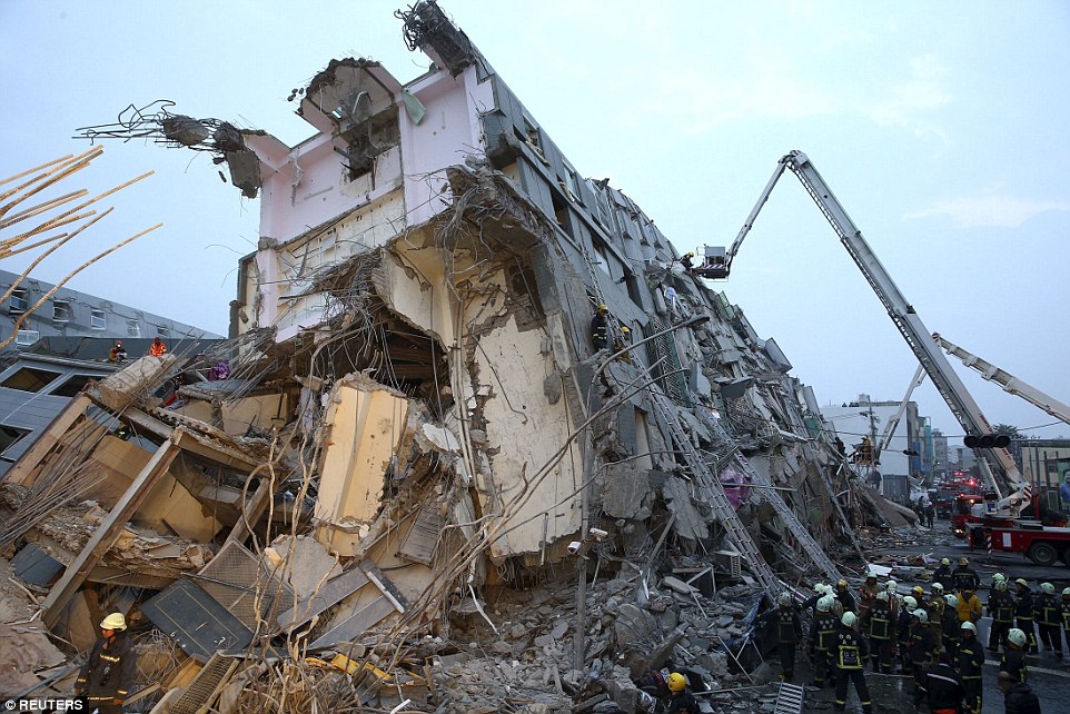 6.4 magnitude earthquake shakes Taiwan,  'Multiple' buildings have collapsed in the city of Tainan 30EC4AC900000578-3434250-Rescue_personnel_work_at_a_damaged_building_after_an_earthquake_-a-11_1454717404270