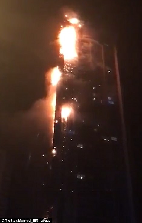 Dubai's record-breaking 1,100ft Torch Tower full of expats bursts into horrific flames in chilling echo of the Grenfell Tower disaster - but, unlike London, its wealthy residents make it out alive 42F21D7A00000578-4759064-Burning_debris_can_be_seen_spiraling_down_to_the_ground_below-a-94_1501804639608