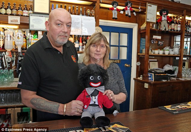 My golliwogs are here to stay, insists pub landlord despite complaints to council and police that keeping them on display behind the bar is a hate crime 4928C42C00000578-5384909-image-a-1_1518513826976