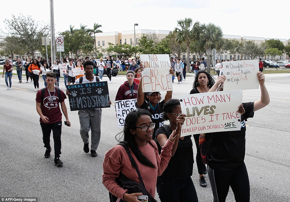 The Serious Side - part 4 - Page 14 4972CB9100000578-5419081-Teens_hold_signs_as_they_participate_in_a_school_walk_for_gun_la-a-132_1519248180146