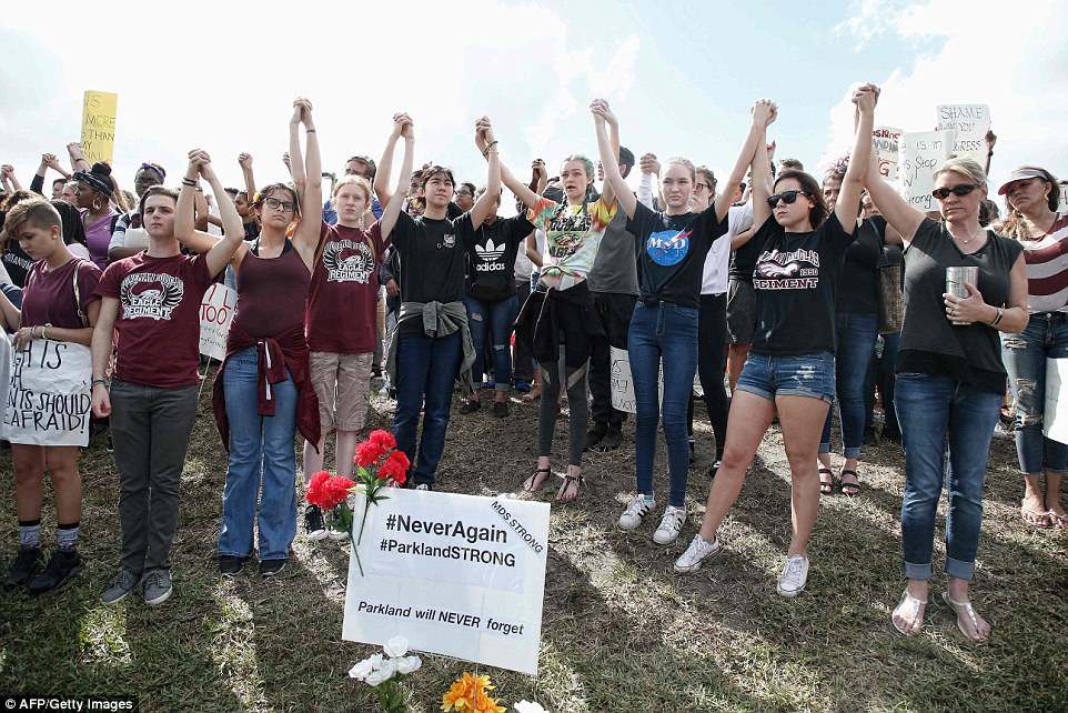 The Serious Side - part 4 - Page 14 4974710B00000578-5419081-Marjory_Stoneman_Douglas_High_students_chanted_never_again_as_th-a-147_1519248180787