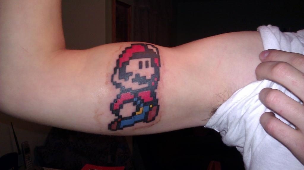 My new tattoos!!!  Check em out!  WARNING: True gamers only IMAG0287