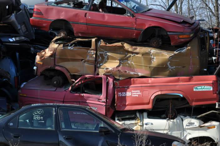 VW camper in a junk yard. 3-5-12490