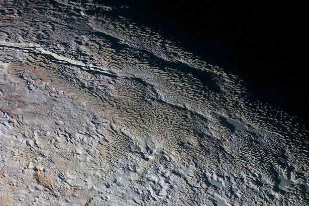 Blue skies on Pluto: NASA New Horizons probe spots 'gorgeous' vistas on icy dwarf planet Pluto-Snakeskin