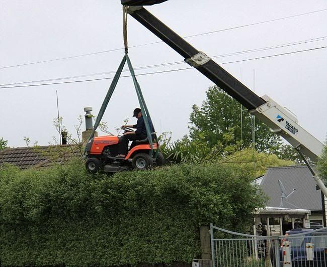 You know your neighbour's a redneck when... Redneckhedgetrimming