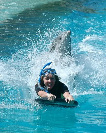 Miley gets a sea lion kiss Cyrus-3