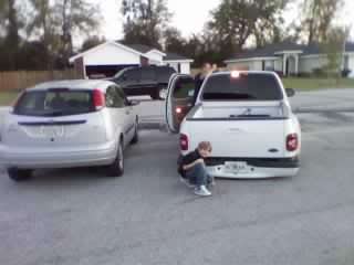 took some pics today of my son with my buddys bagged truck Mar30_002