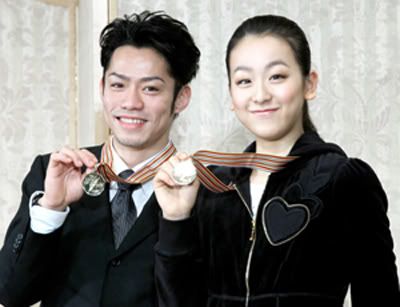 Japan's gold medal skaters Asada, Takahashi return home promising more success Maodaimedal-1