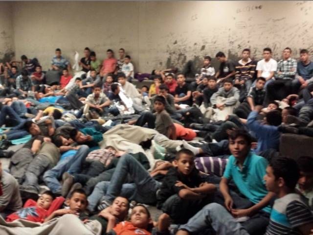 Ex border agents say the floods of illegals done on purpose for political reasons Immigrants-warehouse_zps88f48888