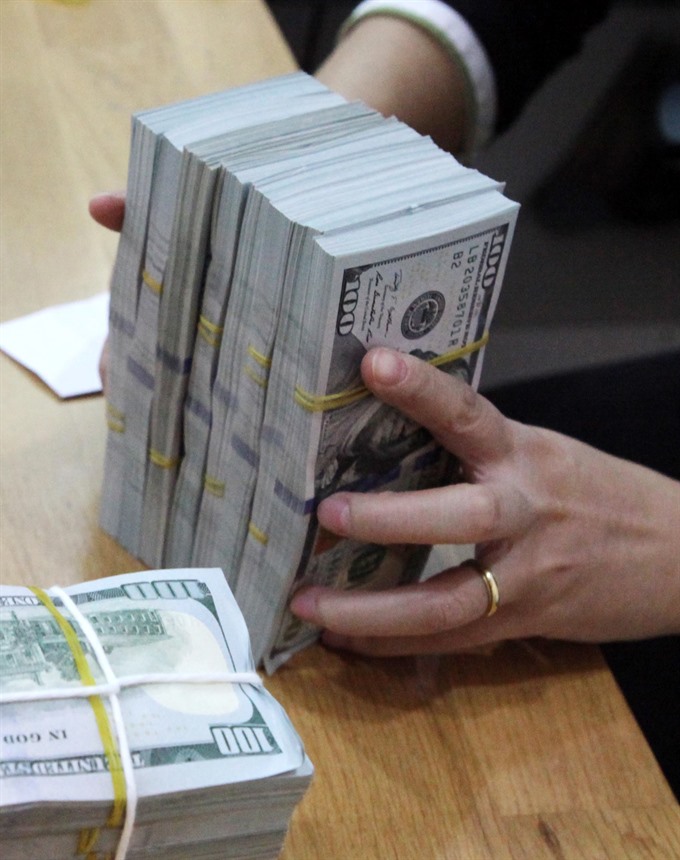 Đồng-dollar exchange rate hits record high 1301-Ngoaite27555620PM