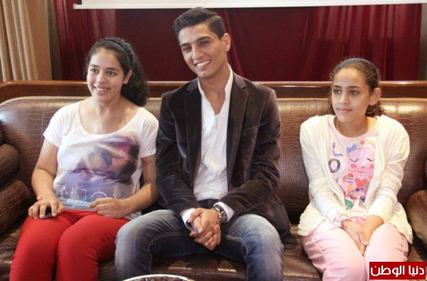 صور محمد عساف يشارك في علاج تجميلي لضحايا الحروب 2014 3910005454