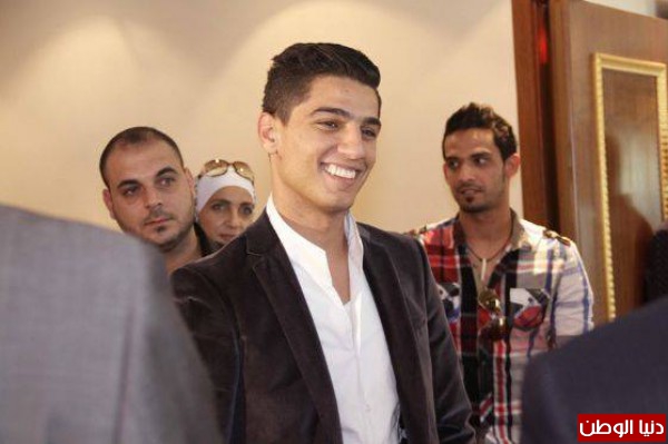 صور محمد عساف يشارك في علاج تجميلي لضحايا الحروب 2014 3910005464