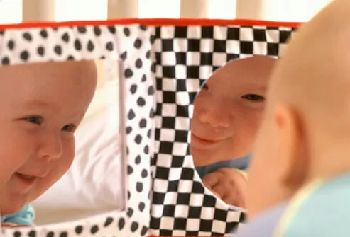 Baby Development - 12 Ways to Help Your Infant Learn & Grow slideshow S3-baby-in-playpen