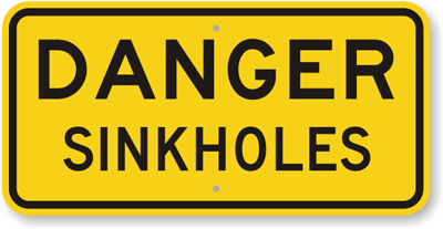 Giant sinkhole opens up in New Zealand Danger-Sink-Holes-Sign-K-9018