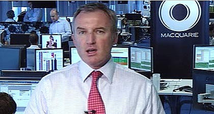 Bwahahaha! Macquarie Bank worker captured on live television ogling half-naked photographs Mac420-420x0