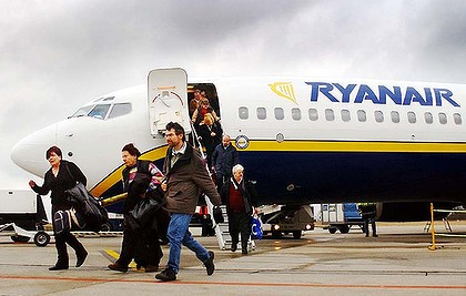 The absurd: Ryanair investigated over exit row charges Art-Ryanair-Passengers-420x0