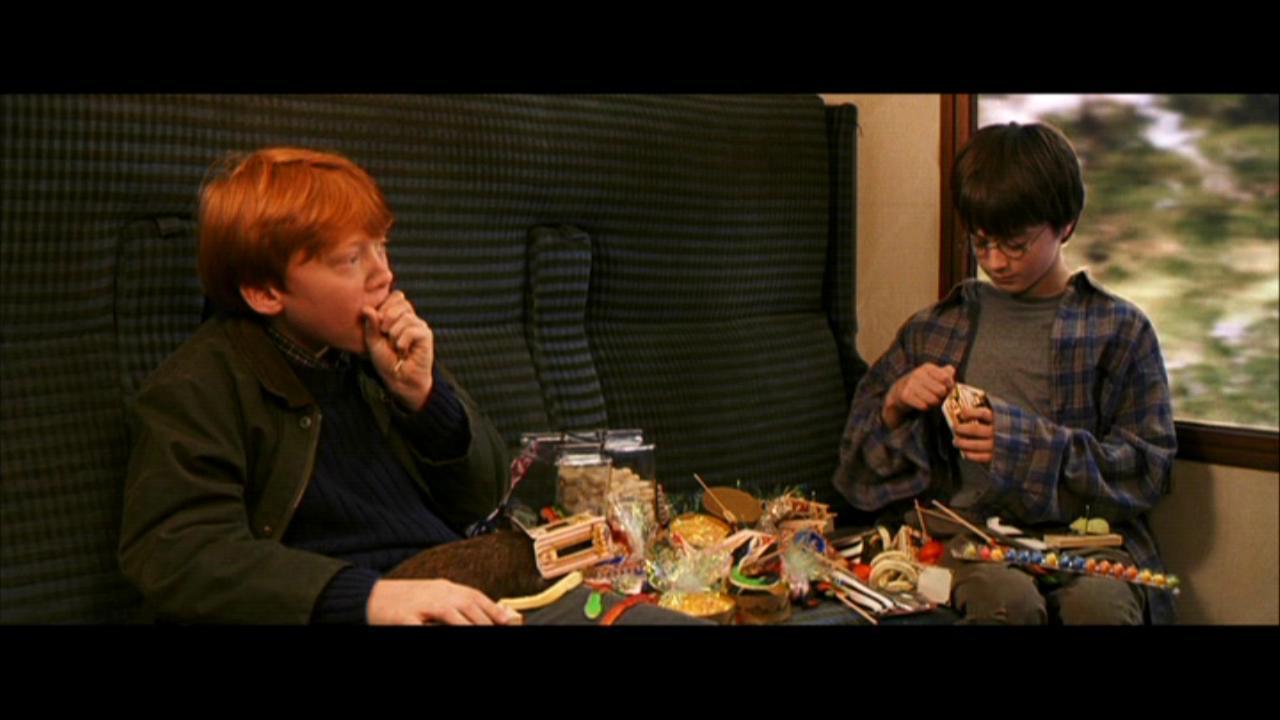 Le jeu des images - Page 33 Ron-and-harry-eating-candy-harry-potter-movies-16643438-1280-720