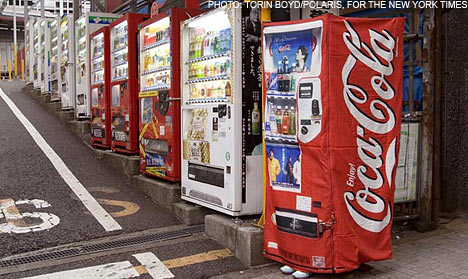 Japanese skirt that lets you transform into a coke vending machine so that you don't get raped CokedressNYT2210_468x279