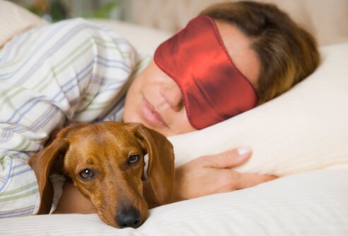 10 Ways to Reduce Stress & Revitalize Your Life Getty_rf_photo_of_dog_and_sleeping_woman