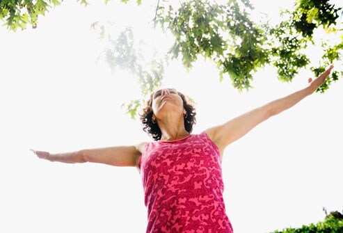 10 Ways to Reduce Stress & Revitalize Your Life Getty_rf_photo_of_woman_with_outstretched_arms