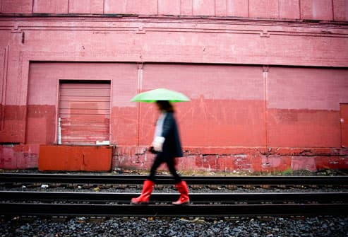 10 Ways to Reduce Stress & Revitalize Your Life Getty_rm_photo_of_woman_walking_in_rain