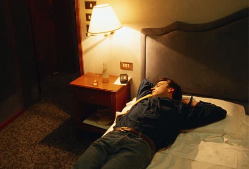 12 Myths About Your Hangover  Getty_rf_photo_of_man_sleeping_in_clothes