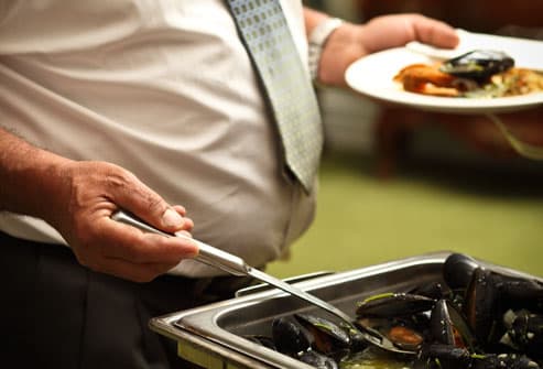 Embarrassing Male Body Problems Getty_rf_photo_of_man_at_buffet