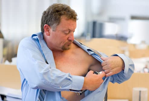 Embarrassing Male Body Problems Getty_rm_photo_of_man_applying_deodorant