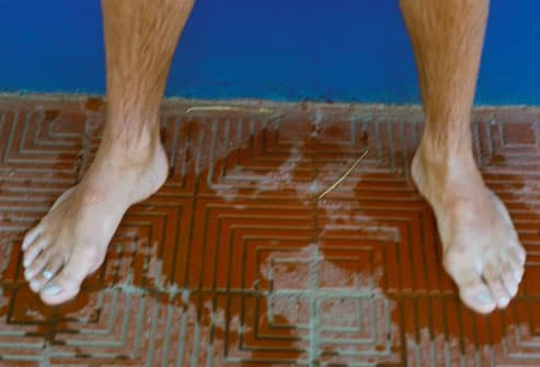 Embarrassing Male Body Problems Getty_rm_photo_of_mans_feet_at_pool