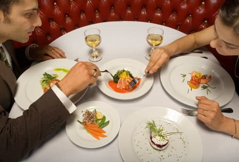 Top 24 Ways to Lose Weight Without Dieting Getty_rm_photo_of_young_couple_eating_dinner