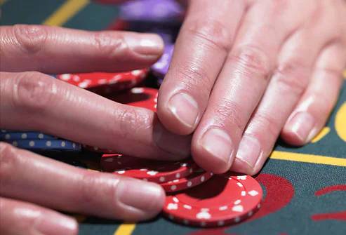 What do your nails say about your health? Getty_rf_photo_of_hands_gathering_roulette_chips