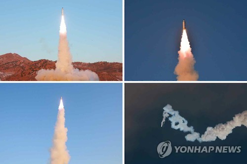 North Korea's Kim Approves New Ballistic Missile "Deployment For Combat" AEN20170521003552315_01_i