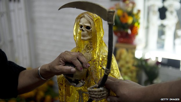 Vatican declares Mexican Death Saint blasphemous _67496301_goldensantamuerte