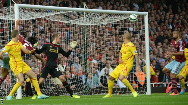 Liverpool suffered their third defeat in five Premier League games this season as West Ham emerged victorious at Upton Park.  _77719348_reid_hammersoneup_epa