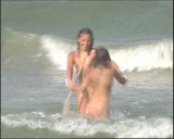 Family nudism. Naked nudists with their naked children.Dressed With A Smile 1054973-thumb