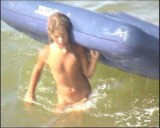 Family nudism. Naked nudists with their naked children.Dressed With A Smile 1055007-thumb