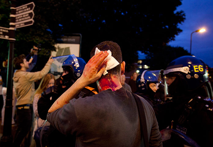 Riots in London and Beyond in pictures A-photographer-holds-his--009