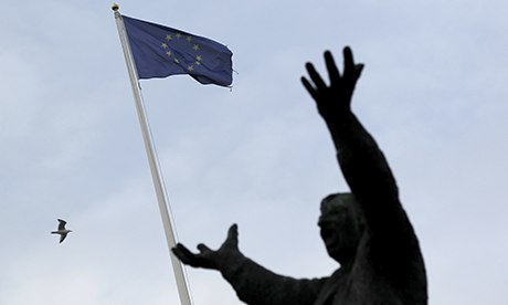 Ireland becomes first country to exit eurozone bailout programme EU-flag-behind-statue-of--008