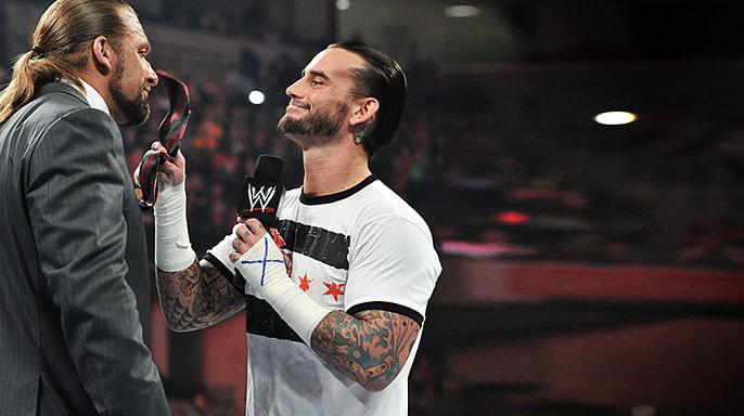 Qui pour briser le record de Punk ? Cm-punk-vs-triple-h-2062795