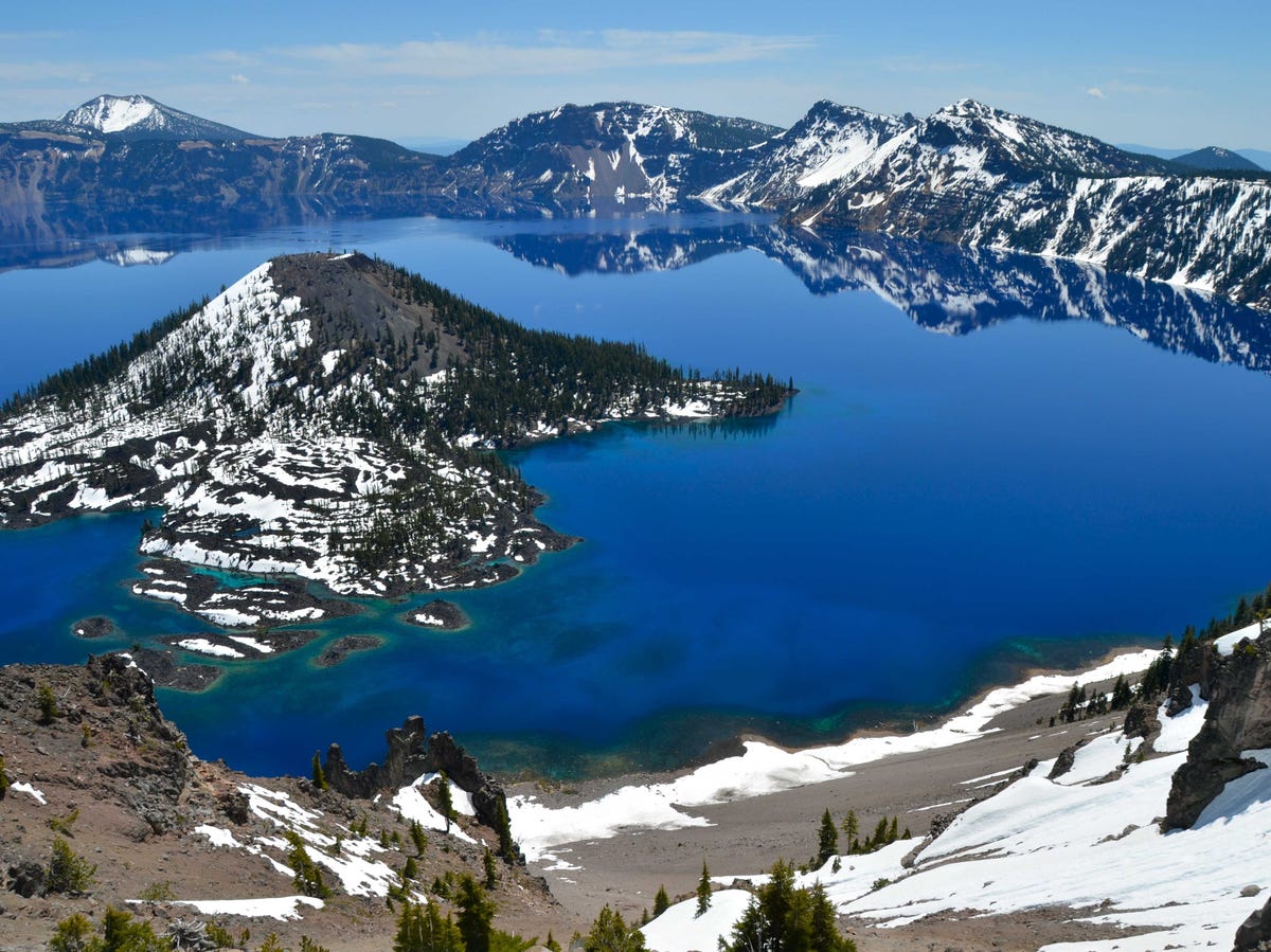 The Best Tourist Attraction In Every State Oregon-circumnavigate-crater-lake-one-of-the-deepest-lakes-in-the-world-the-lake-known-for-its-striking-blue-color-was-formed-in-the-caldera-of-a-collapsed-volcano