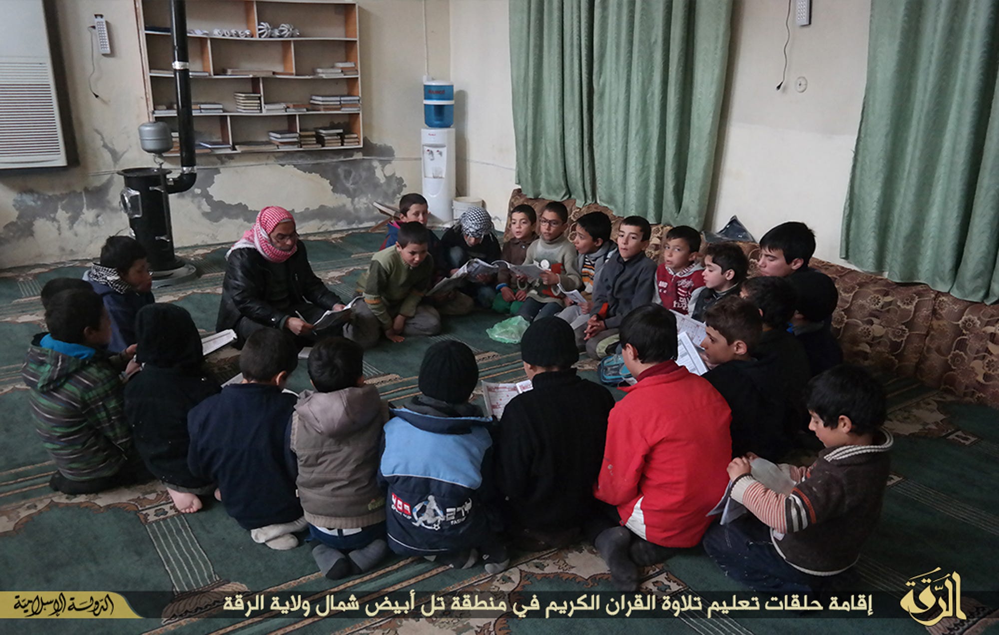 ISIS is indoctrinating children in Iraq by forcing them to behead dolls Inside%20the%20caliphate%20_mill%20%284%29