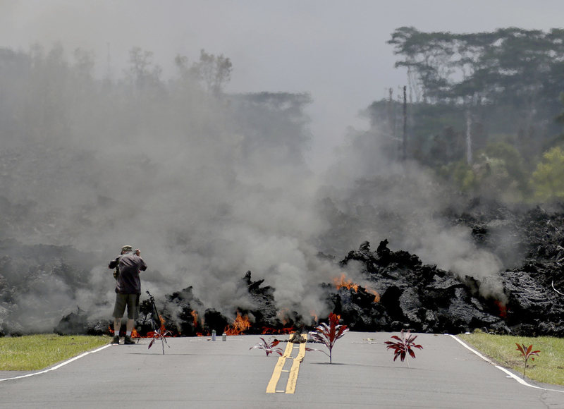 Why Hawaiians place plants before a wall of hot lava in Hawaii Offerings-ti-leaves-hawaii-volcano-eruption