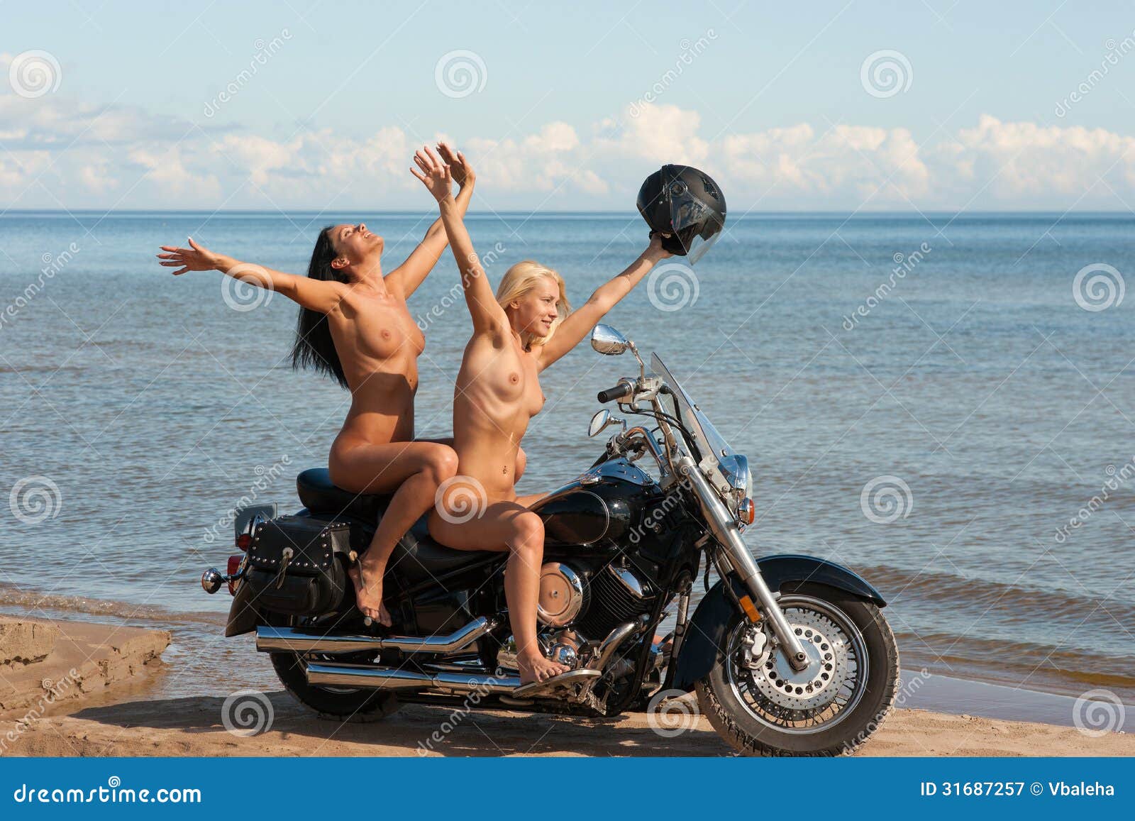 КОНКУРЕНЦИЈА - Page 5 Two-beautiful-naked-women-motorcycle-against-sea-background-31687257