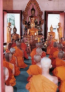 Budizam 220px-Candidate_for_the_Buddhist_priesthood_is_ordaining_to_is_a_monk_in_a_church