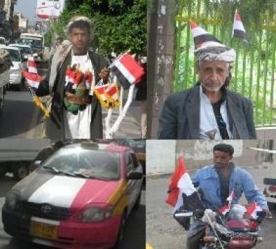 تزايد الاقبال الجماهيري على شراء العلم الوطني في العيد الـ19 للجمهورية اليمنية 09-05-21-721877200