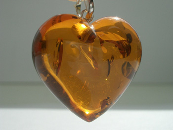 +(  +) -  3 Heart_shaped_amber_pendant