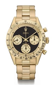 Christies 151110 Rolex_a_rare_and_attractive_18k_gold_chronograph_wristwatch_with_black_d5367658h