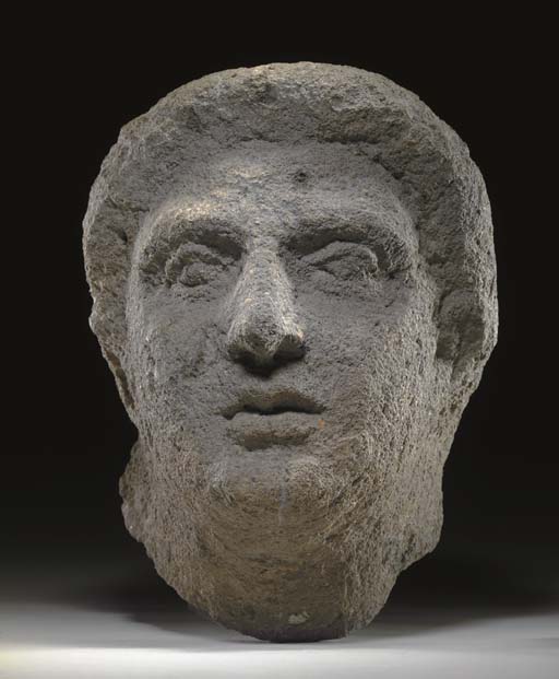 AN ETRUSCAN NENFRO HEAD OF A MAN  D4617443x