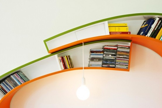 مكتبة عصرية تشمل ركن للمطالعة Creative-bookshelf-to-sink-into-the-universe-of-reading-3-554x370