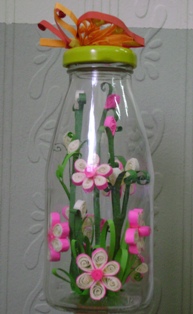 اشغال ورقيـة بشرائط الورق Quilled-flowers-in-bottle